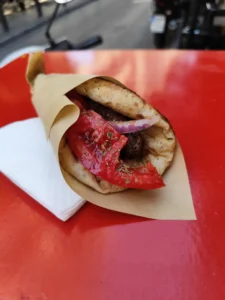 Souvlaki wrapped in a soft pita with grilled meat, tomato, onion and parsley at Tarzan, Kolokotroni Street, Athens